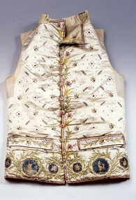 The sleeveless vest worn under the tailcoat, in Venice was called camisiòla, and it was one of the main men's clothing items. Completely buttoned at the front, it was a widespread style at the end of 1600s. Initially it was long, even down the knee, then it was worn shortened to the waist. Meanwhile, it was accentuated with decorations by embroiderers, who created true masterpieces. The Museum of Palazzo Mocenigo in Venice exhibits over fifty specimens of the vest-like camisiòla.