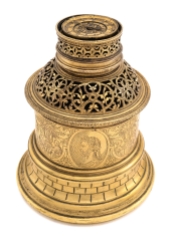 A very rare gilt-brass circular clock case, French, circa 1580 Horizontal dial with central alarm disc and touch pieces, later verge and balance watch movement, signed Heinric Wagner, Pirna, within a pierced drum case above a similarly pierced dome, the central band finely engraved with four portrait medallions divided by seated figures beneath a tree, moulded brickwork base incorporating a probable makers mark depicting a sun above an arm holding a bunch of flowers; together with a later cover and finial 16cm. 6¼in. high Sold by Sotheby's. Private collection.