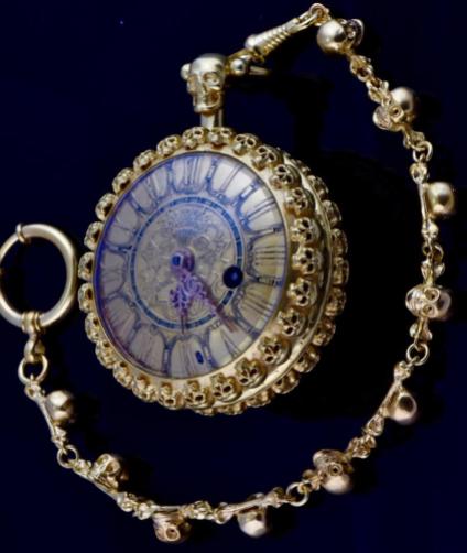 Verge Fusee Oignon gilded silver pocket watch, ca 1700’s, by Derabour a Paris. Derabour a Paris supplied the french Royal Court of Louis XIV. The watch is decorated with 96 small skulls, Memento mori. The watch comes with the matching gild skulls chain fob. Gilded verge movement, fusee chain, giant balance, fancy engraved and pierced balance cock depicting the French Bourbon Lily. Private collection