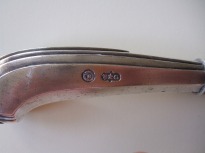 Detail of hallmarked knife from twenty-piece silver cutlery service for six people. Venice, 18th century. The hallmarks from the Venice Mint clearly show the lion in moeca, and the initials of the silversmith, B.G. Private Collection