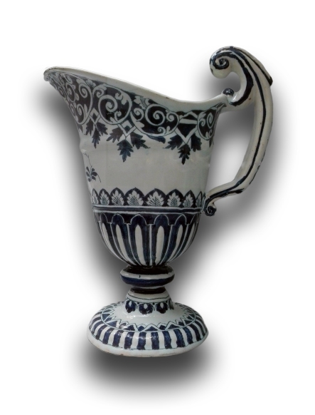 Water jug, decorated in blue. Ceramic, Rouen, first half of the 18th century. Displayed at the Kunstgewerbemuseum, Berlin. The French town of Rouen had long been the main European producer of the so-called “soft paste porcelain” i.e., produced without the kaolin. It was only with the discovery of kaolin as the essential ingredient that “hard porcelain” was produced in Europe i.e., genuine porcelain. Photo ©AndreaPerego