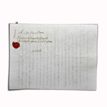 In the 1700s they closed their letters with a seal. They were closed in different ways. In this example we see—especially if you enlarge it—that the sheet was folded twice and then sewn around the edges with red silk. The holes are clearly visible. The two ends of the thread were then fixed with the wax seal. What was the seal for? Obviously, to make sure the letter was not opened during its journey. It was only possible to open the letter by breaking the seal, and the recipient would have noticed it.The seal also served as a guarantee of the sender, whose insignia was stamped on the wax. This seal is of red sealing wax, which was a mixture of shellac and resin with the addition of coloured dyes. The seal is adherent i.e., it fixed directly onto the document support, in this case paper. Photo ©AndreaPerego